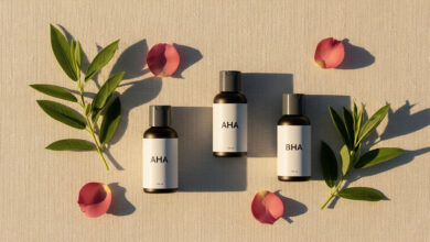 Alt Text: A serene flat lay of minimalist skincare bottles representing the best chemical exfoliants, AHA and BHA, for a hormonal skincare routine tailored to different menstrual cycle phases.