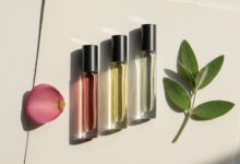 Alt Text: A ranking of the best rollerball perfumes arranged in a clean flat lay, illustrating how to test a scent before buying a full bottle, from an expert guide on choosing perfume.