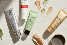 A side-by-side comparison of IT Cosmetics CC cream and Dr. Jart+ BB cream, elegantly displayed on a vanity to showcase options for lightweight coverage.