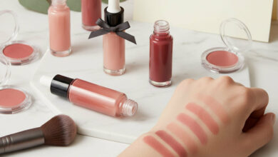 A collection of the best liquid blushes in various shades, with swatches on an arm demonstrating their natural and long-lasting color on a marble surface.