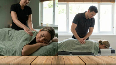 woman wearing a comfortable dusty rose sweater, smiling with relief as she gently stretches her back in a sunlit room with sage green accents